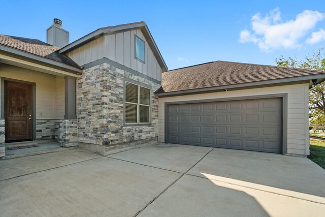 view of side of home featuring a garage