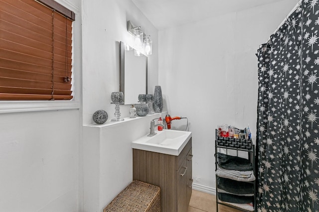 bathroom featuring tile patterned flooring and vanity