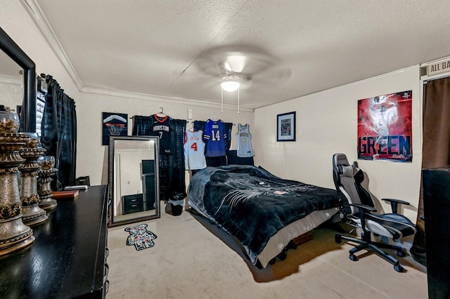 bedroom featuring ceiling fan, a textured ceiling, and ornamental molding