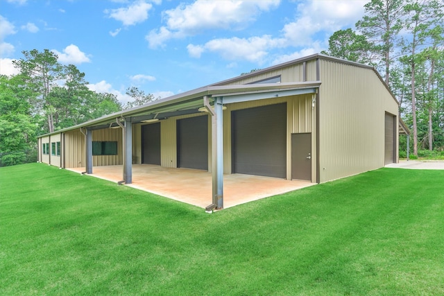 back of property featuring a lawn and an outdoor structure