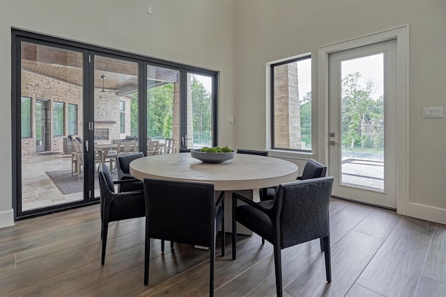 dining space featuring plenty of natural light and french doors