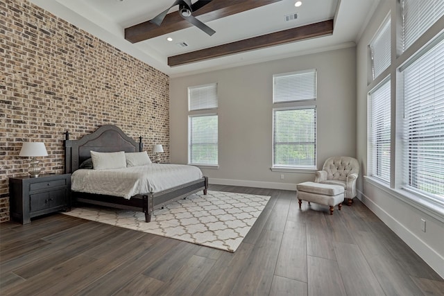 bedroom featuring multiple windows, dark hardwood / wood-style floors, and ceiling fan