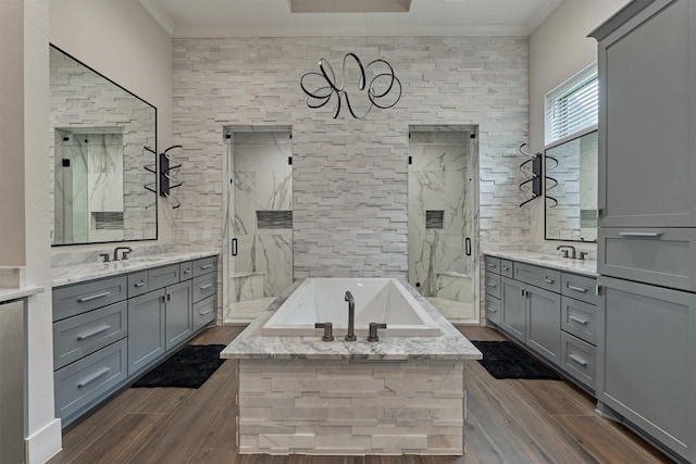 bathroom with shower with separate bathtub, vanity, and crown molding