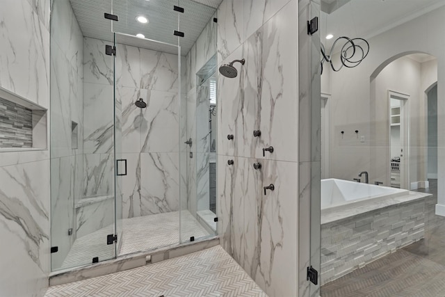 bathroom with separate shower and tub