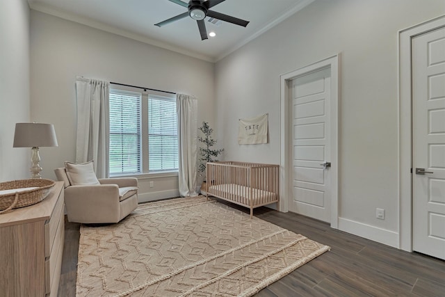 sitting room with ceiling fan, wood-type flooring, and ornamental molding