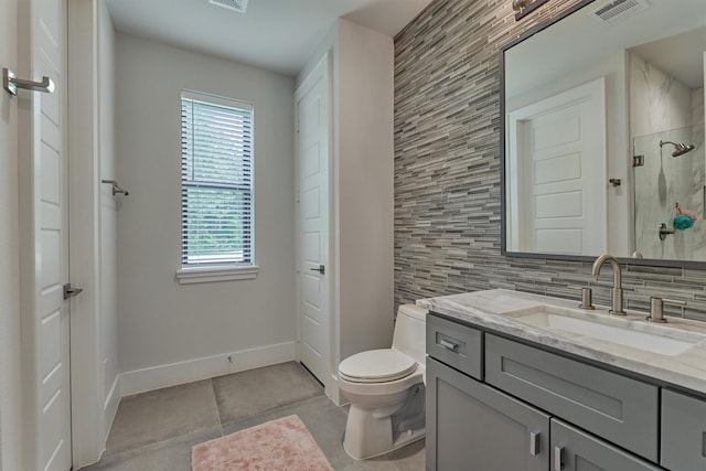 bathroom with a wealth of natural light, a shower, toilet, decorative backsplash, and vanity