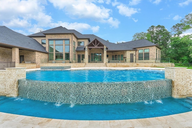 view of swimming pool featuring pool water feature