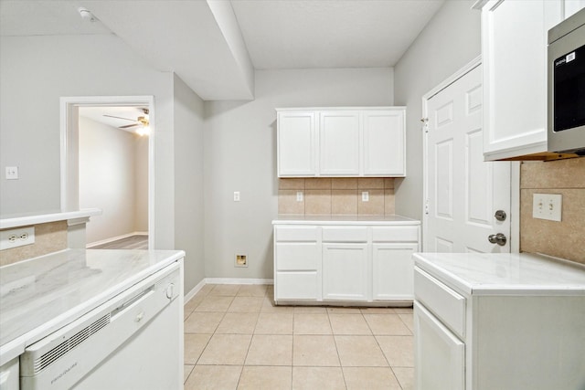 kitchen with white cabinets and decorative backsplash