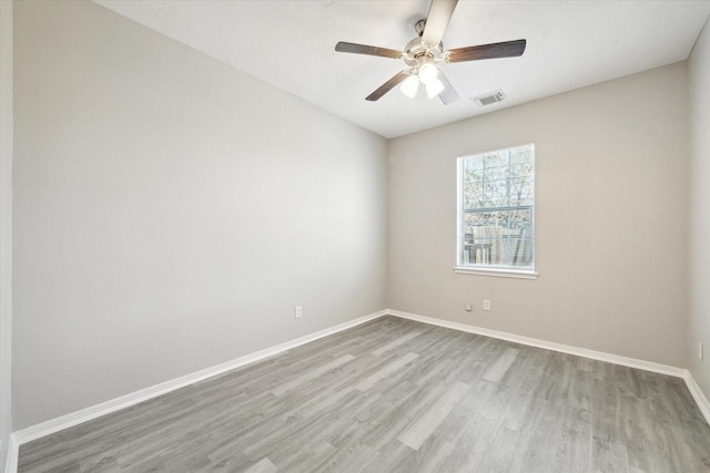 unfurnished room with ceiling fan and light hardwood / wood-style flooring