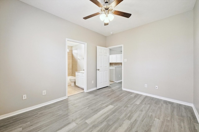 unfurnished bedroom featuring connected bathroom, light hardwood / wood-style floors, and ceiling fan