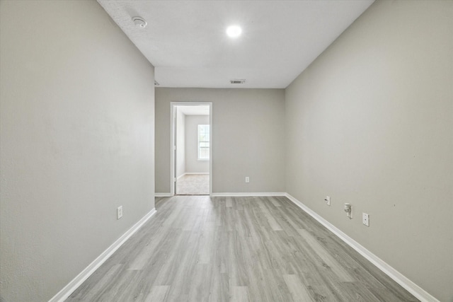 empty room with light wood-type flooring