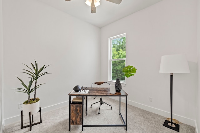 office space with ceiling fan and light carpet