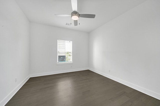 unfurnished room featuring ceiling fan and dark hardwood / wood-style flooring