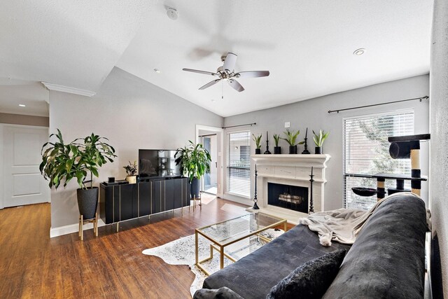 living room featuring a textured ceiling, ceiling fan, dark hardwood / wood-style flooring, and lofted ceiling