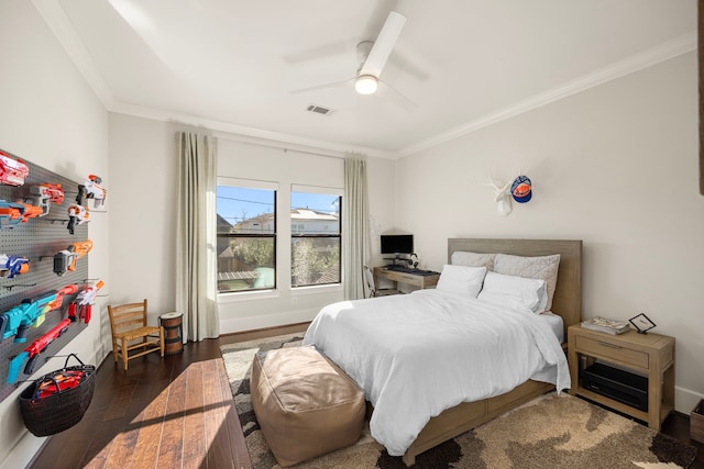 bedroom with ceiling fan, dark hardwood / wood-style floors, and ornamental molding