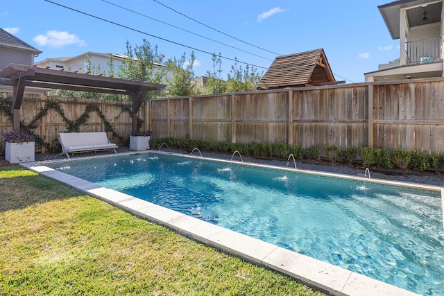 view of swimming pool featuring a pergola, pool water feature, and a yard