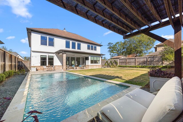 view of swimming pool with a patio and a lawn