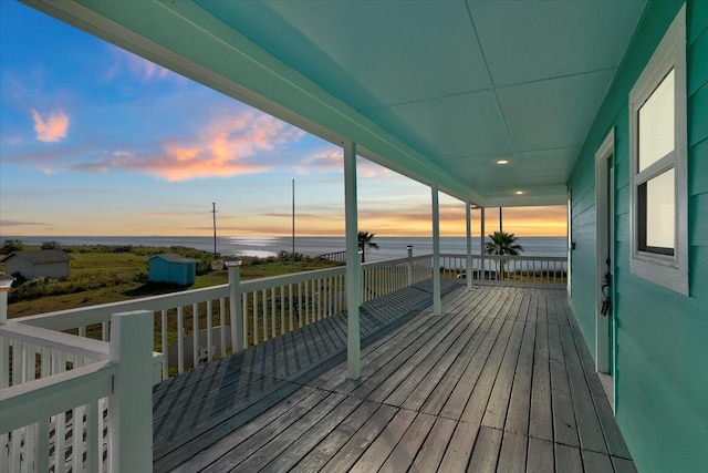 deck at dusk with a water view