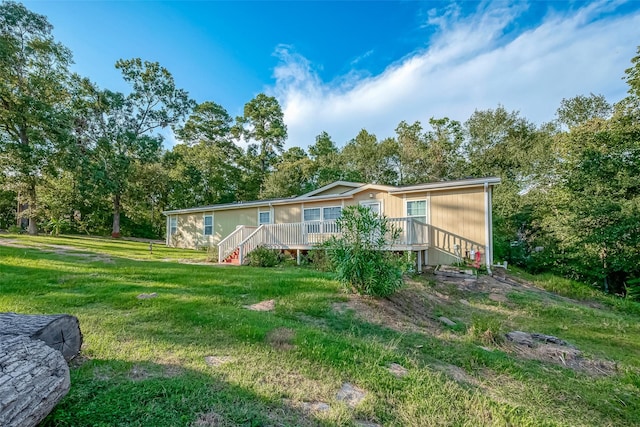 rear view of house with a yard