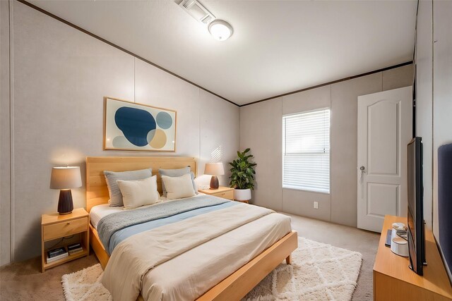 bedroom featuring light carpet