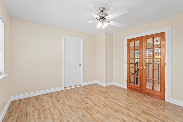 unfurnished room featuring ceiling fan, french doors, and light wood-type flooring