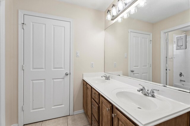 bathroom featuring tile patterned flooring and vanity