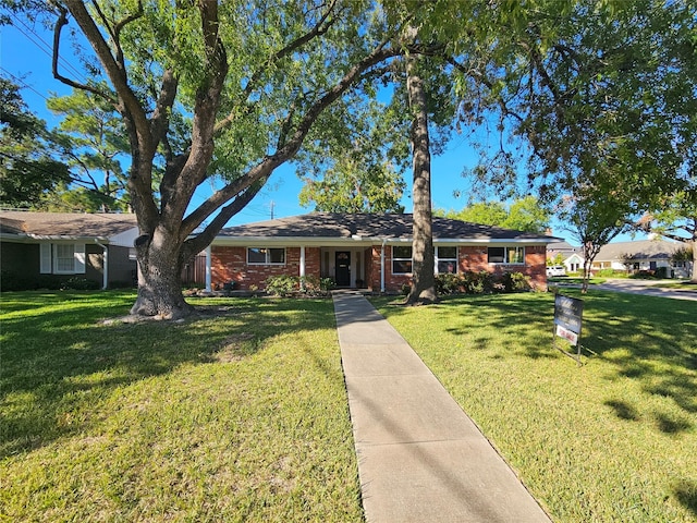 ranch-style home with a front yard