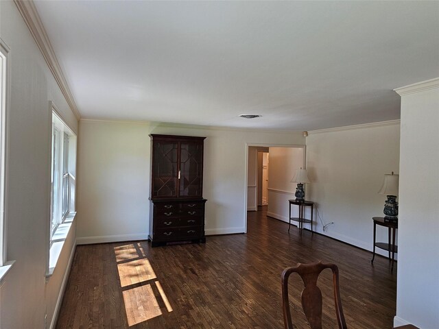 interior space featuring dark hardwood / wood-style flooring and ornamental molding