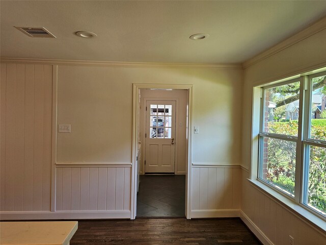 doorway to outside featuring ornamental molding