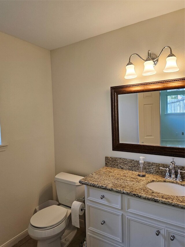 bathroom with vanity and toilet