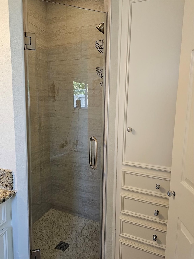 bathroom with vanity and an enclosed shower