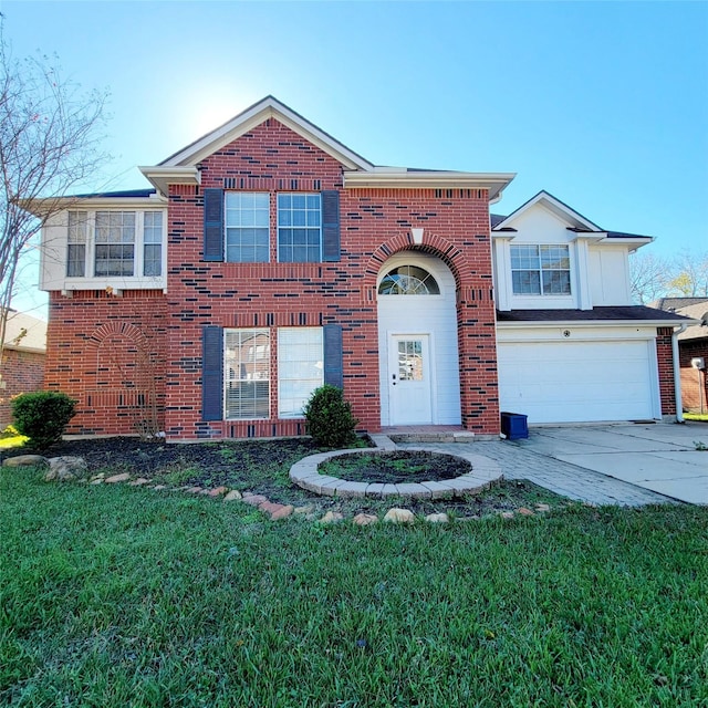 view of front of house featuring a garage and a front lawn