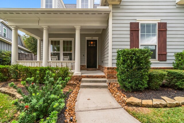 entrance to property with a porch