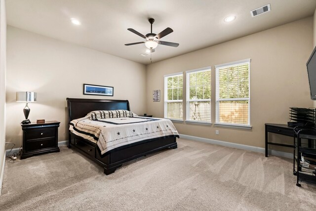 bedroom with light colored carpet and ceiling fan