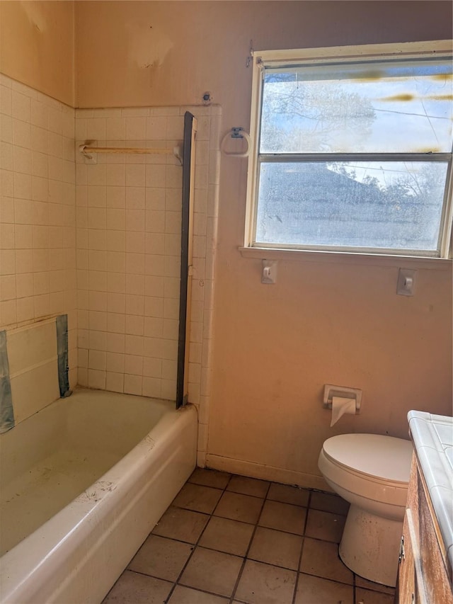 full bathroom with tile patterned flooring, vanity, toilet, and plenty of natural light