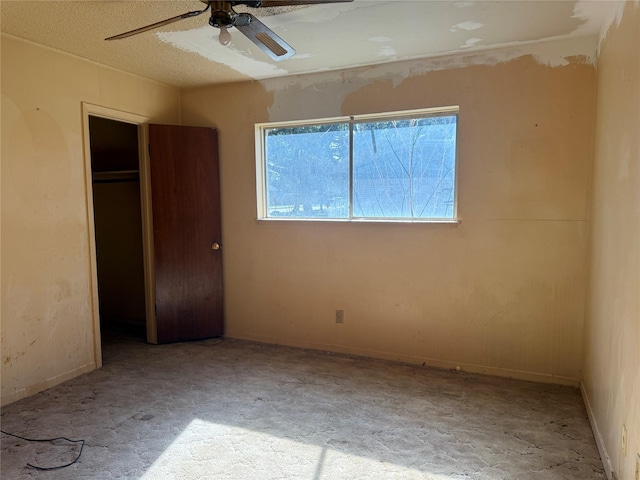 unfurnished bedroom with a closet and ceiling fan