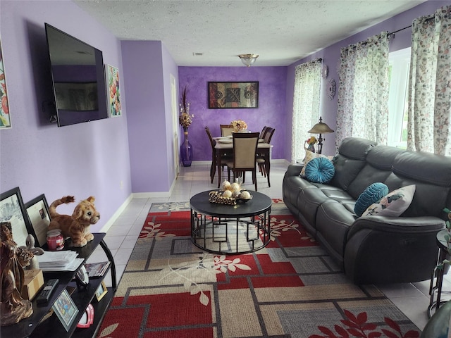 living room featuring light tile patterned floors and a textured ceiling