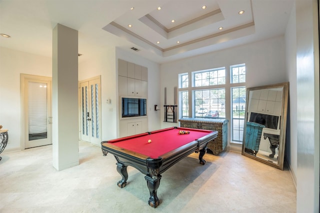 recreation room featuring crown molding, pool table, a raised ceiling, and a high ceiling