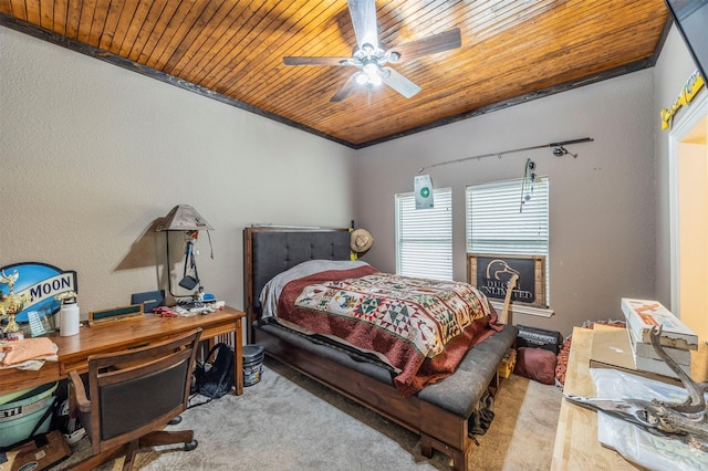 carpeted bedroom with wood ceiling, ceiling fan, and crown molding