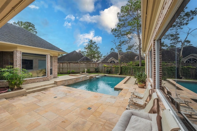 view of swimming pool with a patio