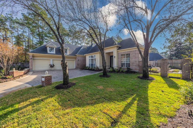 view of front of house featuring a garage and a front lawn