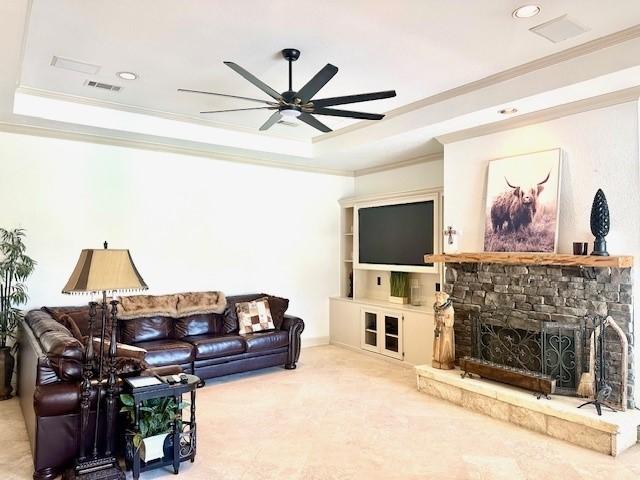 4418 Greens Court Way, Houston, TX 77339 - living room featuring crown molding, a raised ceiling, ceiling fan, recessed lighting, and a fireplace