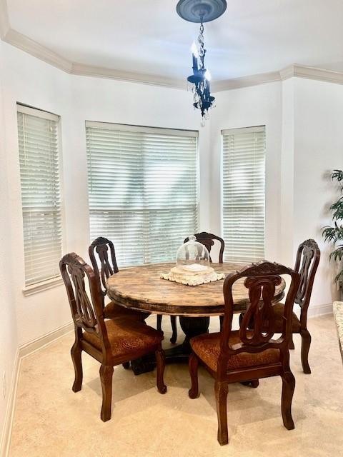 4418 Greens Court Way, Houston, TX 77339 - dining space featuring crown molding, light carpet, and baseboards