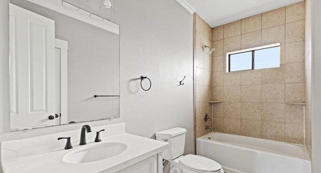 full bathroom with toilet, vanity, ornamental molding, and tiled shower / bath