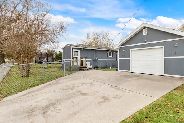 view of front of property with a front yard and a garage