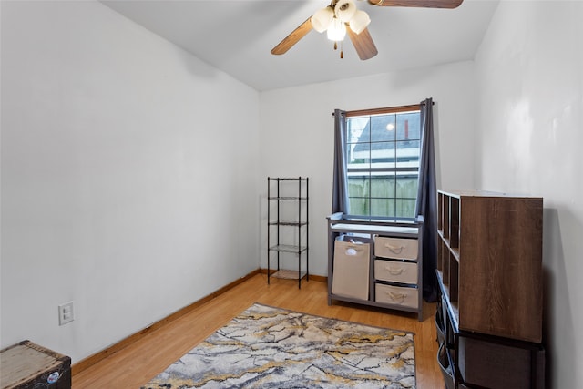 interior space with ceiling fan and light hardwood / wood-style flooring