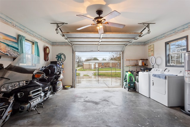 garage with independent washer and dryer, ceiling fan, and water heater