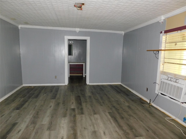 unfurnished room featuring dark hardwood / wood-style flooring, cooling unit, and ornamental molding