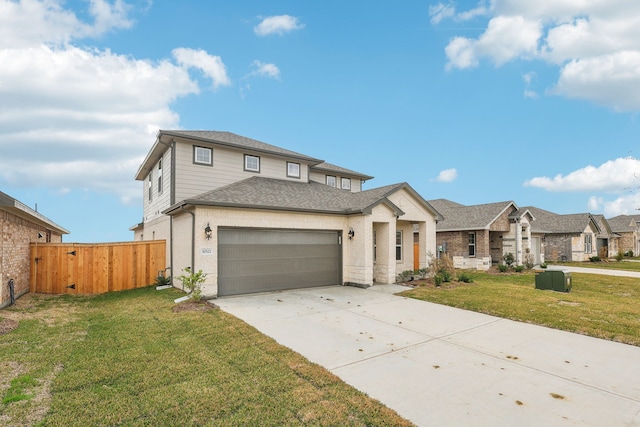 view of front of house with a garage and a front yard