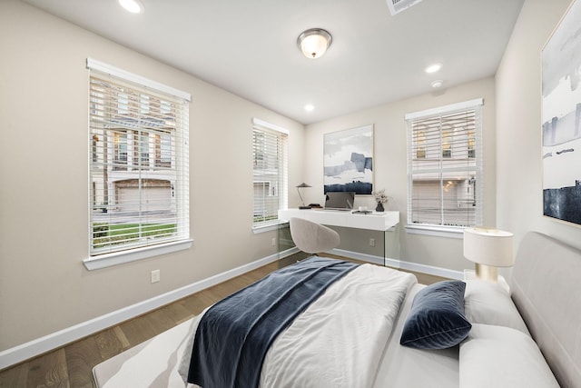 bedroom featuring hardwood / wood-style floors